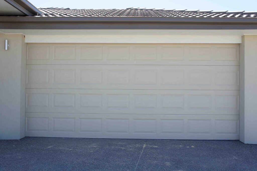 Sectional garage door with square embossments